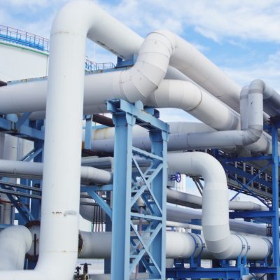 closeup industrial pipelines around factor sunny day (1) (1)